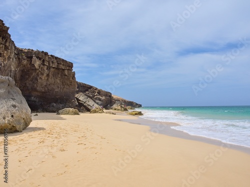 Beach and cliffs on the Atlantic coast. Clear day. Boa Vista Island, Cape Verde.