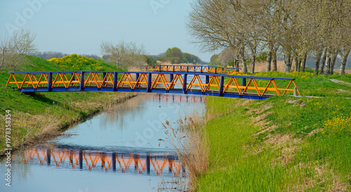 Wallpaper Mural Bridges over a canal through fields in bright sunlight in springtime, Almere, Flevoland, The Netherlands, April 8, 2026 Torontodigital.ca