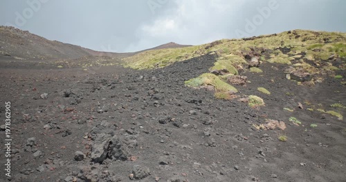 Landscape view of the dark volcanic hills and dry grass near Etna Volcano, 4k