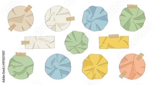 Creative arrangement of paper circles and strips on white background showing different colors and wrinkled textures during a crafting session
