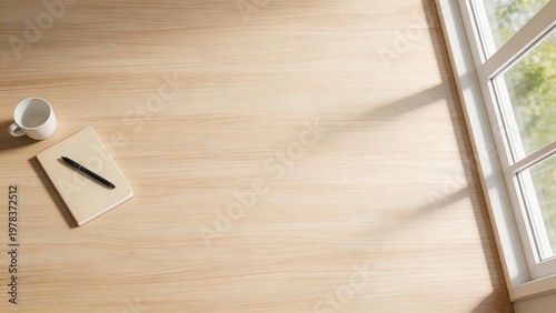 Wooden desk with notebook and cup