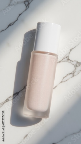 A single bottle of liquid sitting on a white marble surface