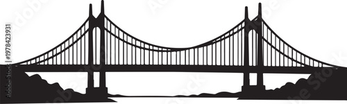 Silhouette of a suspension bridge over water at dusk