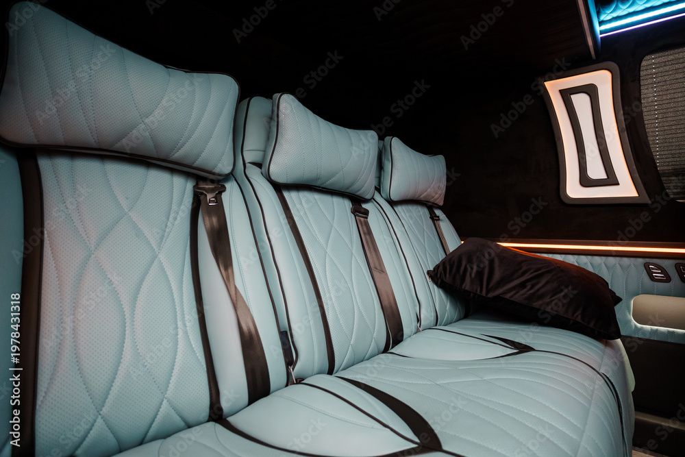 Fototapeta premium Luxury Light Blue Leather Passenger Seats in High End Private Van or Executive Transport Vehicle