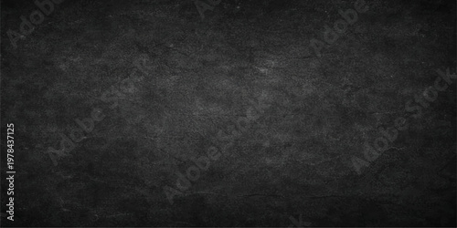 Empty vintage black chalk board with a dirty grunge concrete texture and a blank grey stone surface pattern for a dark wallpaper backdrop design