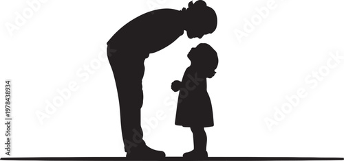 Adult and child sharing an intimate moment in silhouette art