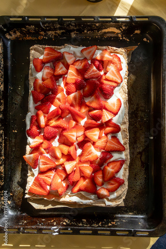 Stockholm, Sweden A starwberry and meringue cake with whipped cream.