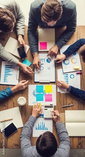 Collaborative Business Meeting - Analyzing Data and Planning Strategies.