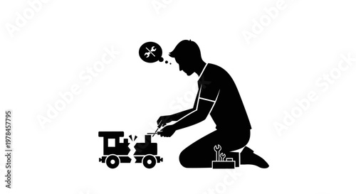 Man playing with toy train set.