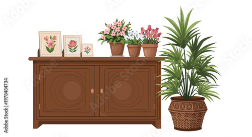 Cozy wooden sideboard furniture is decorated with framed pictures of flowers and various potted house plants including a palm.