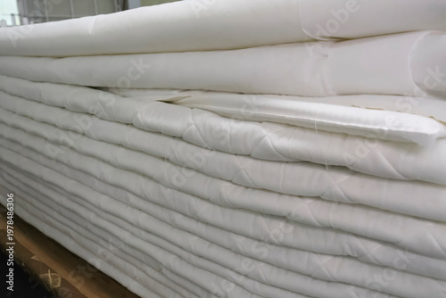 Sewing mattress on special machines at garment factory, the outer soft part of the mattress