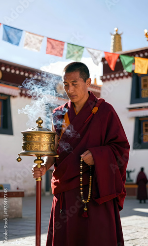 Wallpaper Mural Monk praying with incense in temple courtyard during daylight, Honoring Asian and Pasifika Ancestry Month   Torontodigital.ca