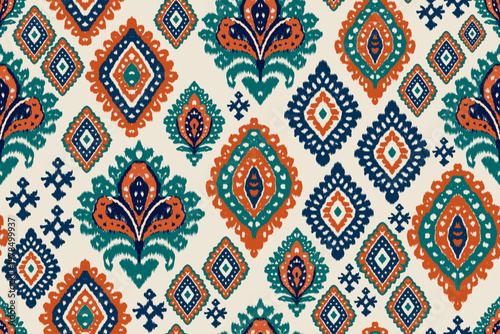 Ikat pattern seamless colorful tribal textile design with geometric diamond motifs and ornamental shapes in orange navy and green tones for fabric and decorative backgrounds.