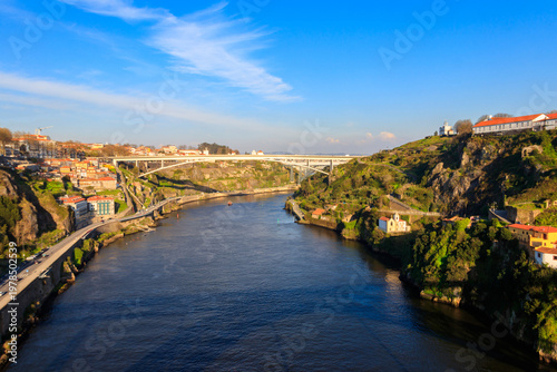 View of Infante Dom Henrique Bridge, commonly known as Infante Bridge, a road bridge across the Douro River in Greater Porto, Portugal