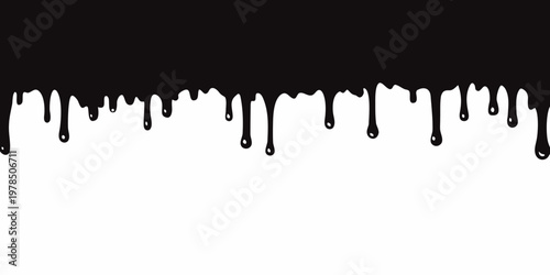 Black liquid drips against a stark white background creating a contrasting pattern