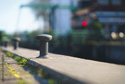 Sunlight warms the weathered stone, casting long shadows on the quay.