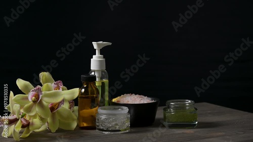 Arrangement of spa and beauty products on black background