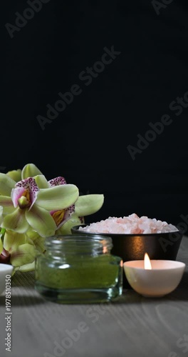 Arrangement of spa and beauty products on black background