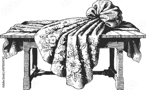 Floral fabric bundle tied on rustic wooden table with detailed engraving illustration