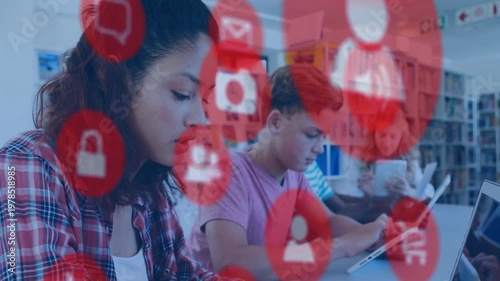 Students typing and tapping devices in library, red icons appearing over scene showing studying