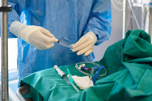 Medical professional preparing syringe for patient treatment