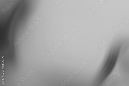 Grey gradient background with abstract blurred waves.