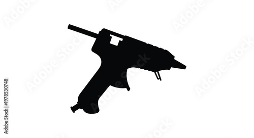 Black silhouette of a hot glue gun clearly defined against a white background silhouette
