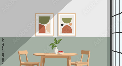 A minimalist dining room features two framed abstract art pieces above a round wooden table