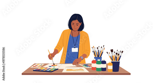 Artist works on a colorful painting at a table in a creative space during a workshop event with various art supplies around