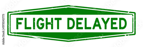 Green flight delayed sign with white text and border