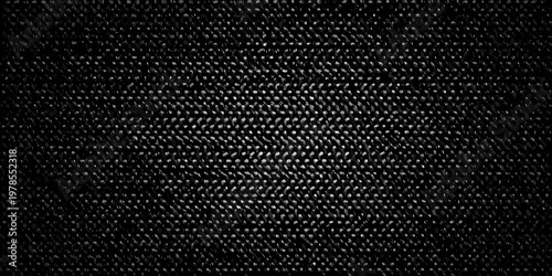 Close up of a dark textured fabric with a woven pattern