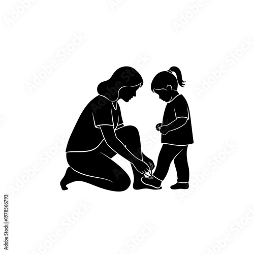 Mother tying daughter's shoelaces silhouette
