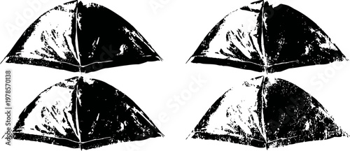 four black tissue paper folded in origami hat shapes on white background