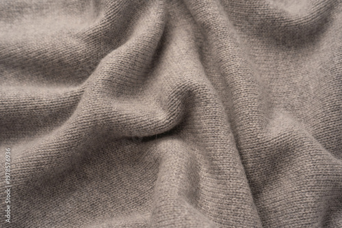 Soft grey merino wool sweater texture as a background.