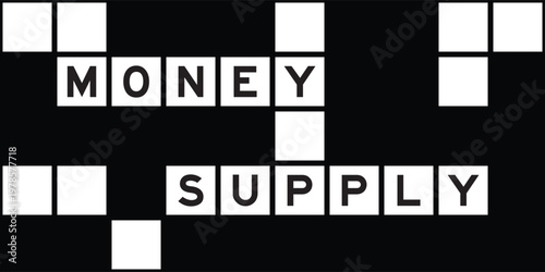 Alphabet letter in word money supply on crossword puzzle background