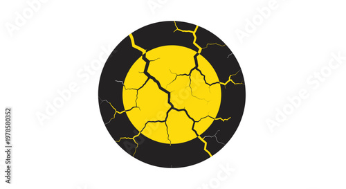A cracked and damaged yellow circle with black lines is shown in a close-up view on a plain surface.