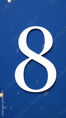 Gold Glitter Blow‑Away Reveal of Number 8 on Solid Background