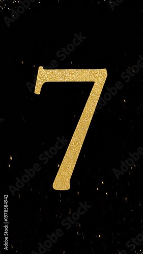 Gold Glitter Blow‑Away Reveal of Number 7 on Solid Background