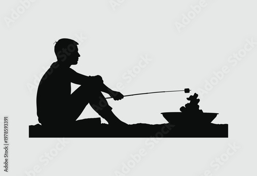 A silhouette of a person sitting peacefully while roasting a marshmallow over a small campfire