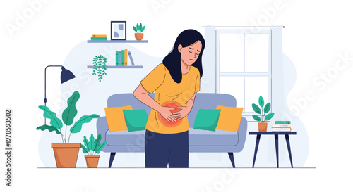 Concerned woman stands in her living room and holds her stomach due to sudden abdominal pain or a digestive health issue.