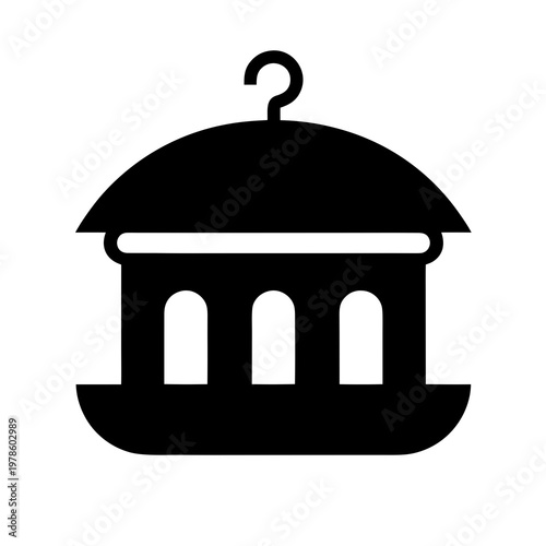 Minimalist bird feeder hanging from a simple hook.