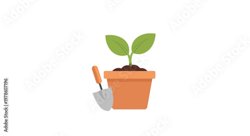Small green plant in pot with shovel.