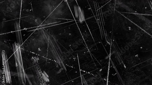 4K Cinematic dark grunge texture overlay featuring intense intersecting white scratches, heavy gouge marks, and scattered dust on a black background for VFX compositing.