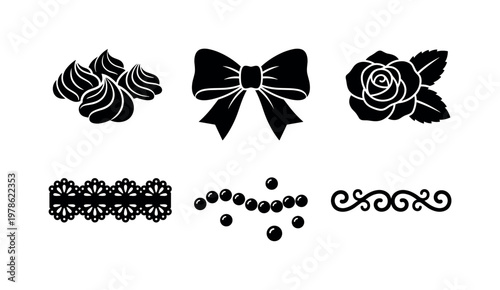 Cake decorations including icing piping swirls, fondant ribbon bow, sugar flower decoration, lace pattern icing, pearl bead cake