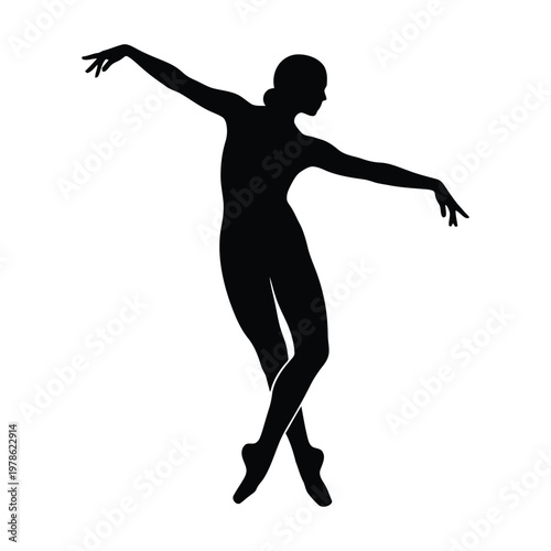 Silhouette of a ballerina gracefully performing a ballet pose with her arms outstretched and legs crossed en pointe