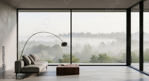 Modern interior with large windows and a view of trees and fog