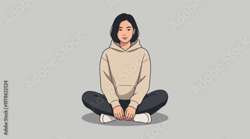 Young Woman Sitting Cross-Legged on Floor.