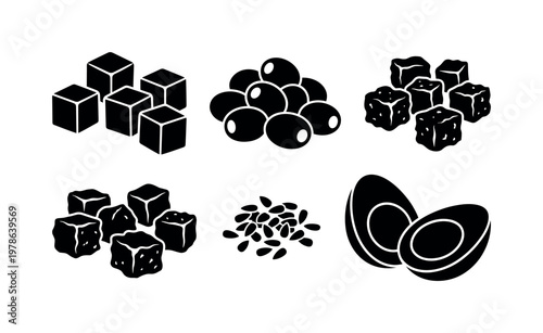 Salad toppings including feta cheese cubes, olives pile cluster, croutons bread cubes, sunflower seeds small pile, sliced boiled