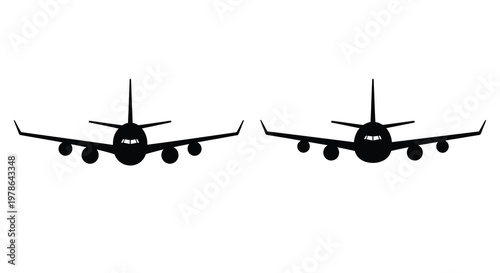 Two black silhouettes of passenger airplanes facing opposite directions