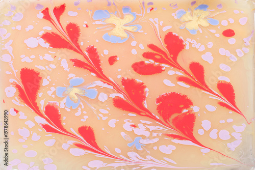 Soft pastel floral Ebru marbling texture with elegant tulip patterns and liquid ink